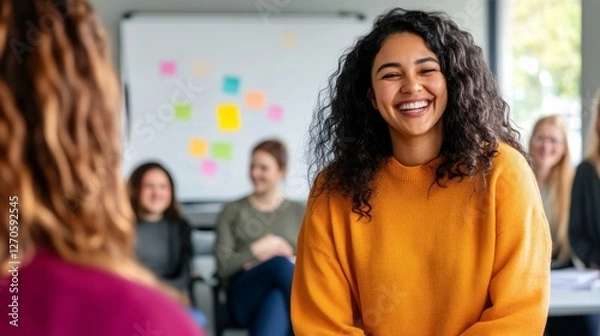 Obraz A diverse group of colleagues enjoys an informal brainstorming session filled with laughter and creativity in a well-lit office space, with vibrant notes on a whiteboard