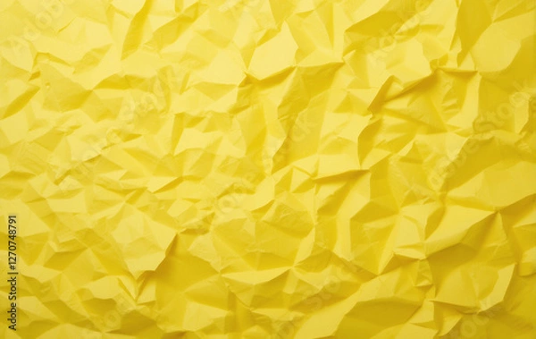 Fototapeta Bright yellow crumpled paper with a textured surface, creating a vibrant, abstract pattern.