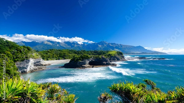 Fototapeta Rugged New Zealand Coastline With Towering Mountains