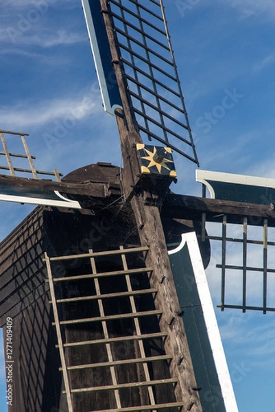 Fototapeta Cross of sails of historic windmill Doris Mooltsje, Oudega, Sudwest-Fryslan, Friesland, Netherlands