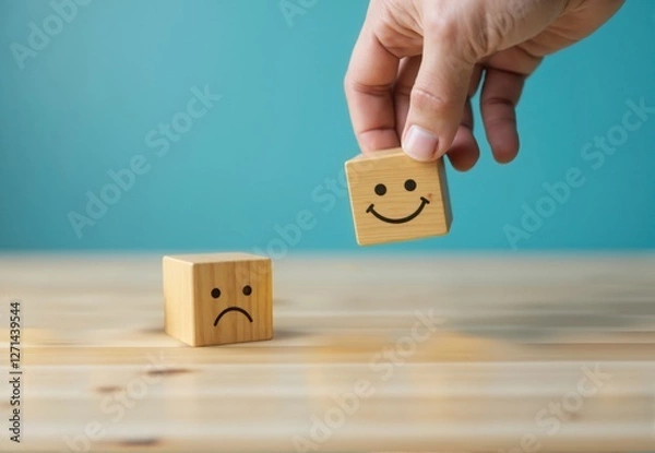 Fototapeta Wooden Cubes Displaying Happy and Sad Facial Expressions