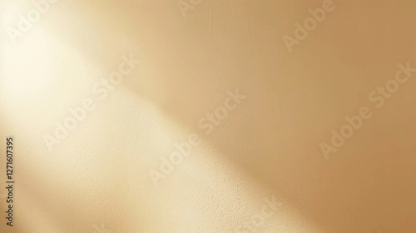 Fototapeta Soft golden light illuminating a textured wall, creating a warm ambiance for interior design