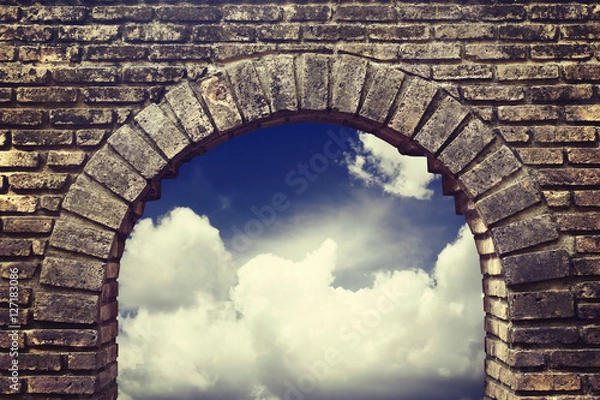 Obraz Background sky looking through an old brick window.