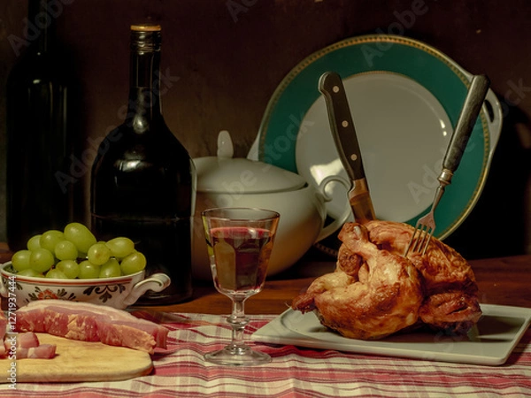 Obraz A stylized antique still life with a grilled chicken, a glass of red wine and lard.	(rotisserie chicken)
