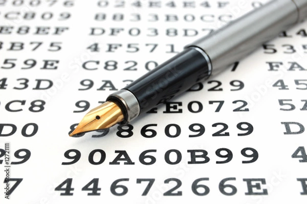 Obraz A gold-nibbed pen on a sheet with encrypted data