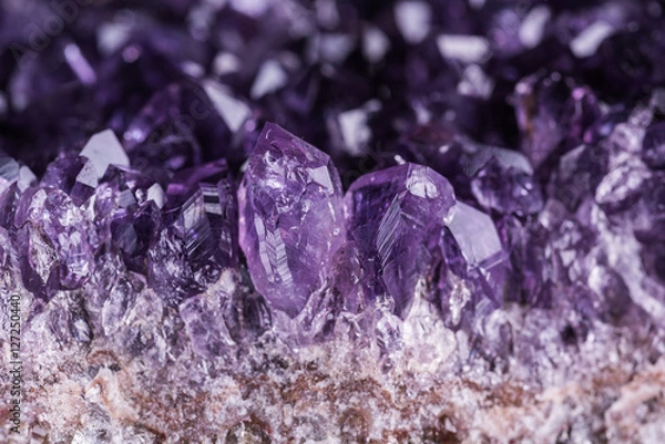 Fototapeta Amethyst geode on black background. Beautiful natural crystals gemstone. Extreme close up macro shot.