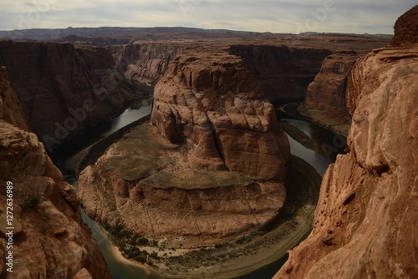 Obraz Panoramic view of Horseshoe Bend under clear skies, showcasing the dramatic curves of the Colorado River in Arizona tribal lands East Rim of the Grand Canyon