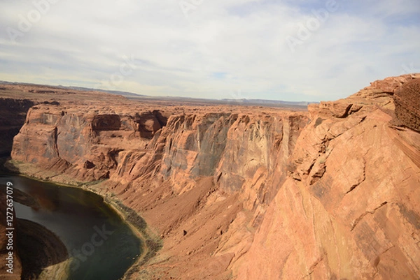 Obraz Expansive view of Horseshoe Bend and the surrounding desert landscape under a wide blue sky in Arizona tribal lands East Rim of the Grand Canyon
