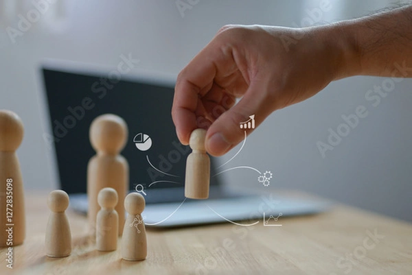 Fototapeta Human management and leadership, Personnel development for business in organization, Businessman use tablets select personnel based on qualifications, Target management, Choose the perfect employee