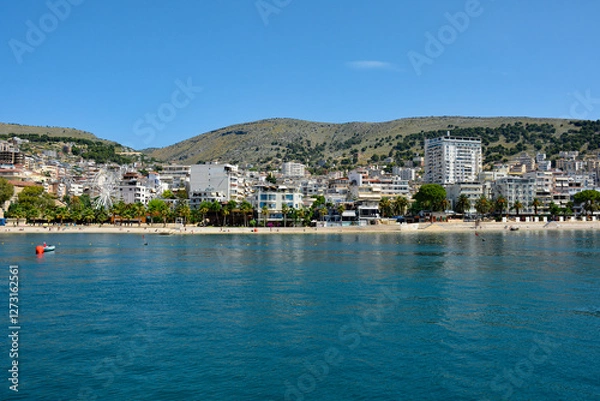 Fototapeta Sarande on the Ionian coastline of southern Albania, part of the Albanian Riviera. Here, the hills of the Ceraunian mountain range meet the Straits of Corfu in the eastern Mediterranean Sea