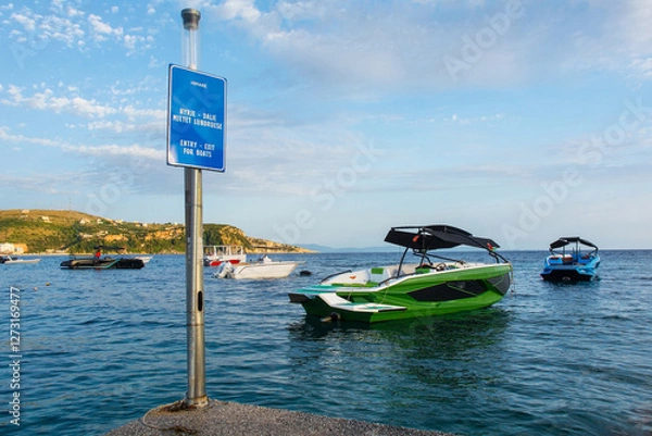 Fototapeta Boats at Spile Beach in Himare Bay on the coast of southern Albania, part of the Albanian Riviera. Located in Vlore County, it lies between the Ceraunian Mountains and the Ionian Sea 