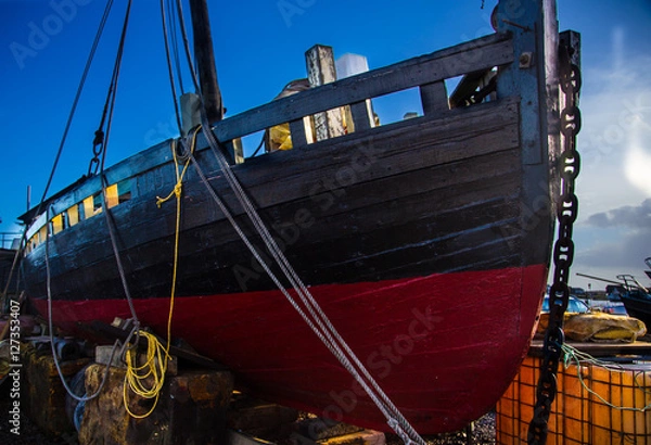 Obraz old boat on blocks