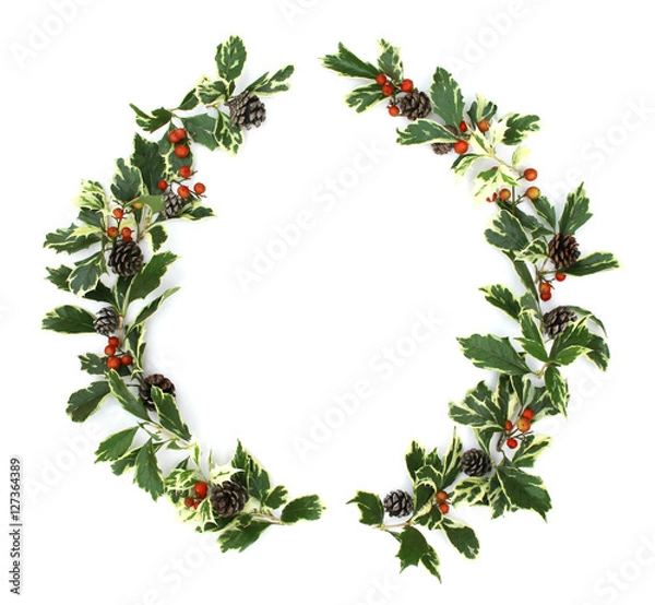 Obraz ヒイラギの葉とナンテンの実と松ぼっくりのクリスマスリース