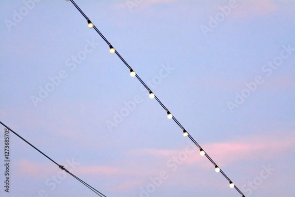 Fototapeta Serene string lights against dusk background