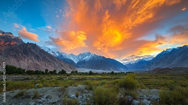 Obraz Majestic Sunrise Over Snow-Capped Mountains and Lush Green Valley
