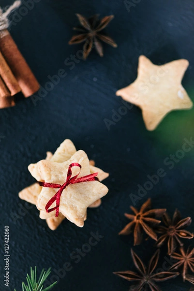 Obraz Star shaped cookies with cinnamon and anise on the table