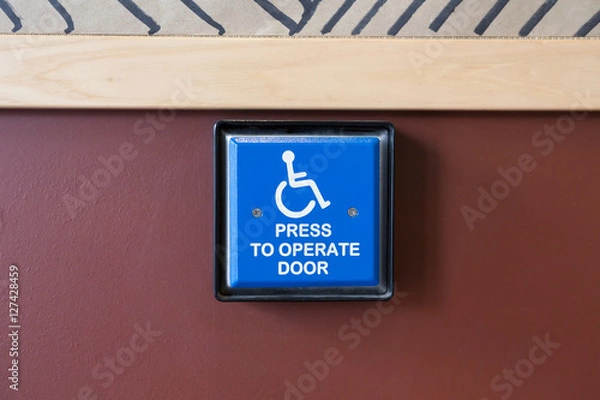 Obraz Handicapped access entrance pad on a wall.