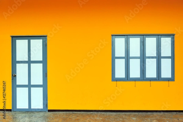 Fototapeta Colorful wall with the door and windows