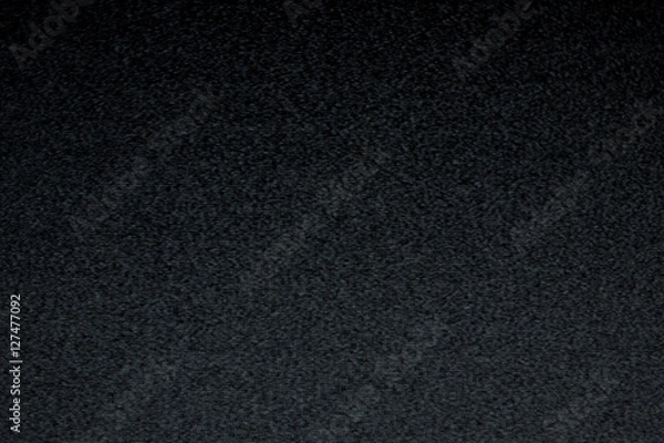 Fototapeta Static noise from an old analog tv screen in the darkness. Real footage, real moirè.
