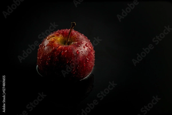 Obraz red apple on black background