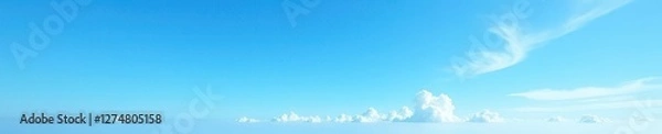 Fototapeta Clear azure sky, wispy clouds on distant horizon, vast, tranquil