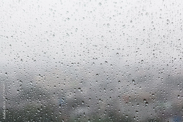 Obraz Rain drops on window glasses surface with cloudy background . Na