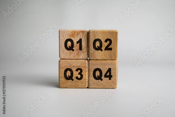 Fototapeta concept of quarterly report on wooden cubes isolated on white background