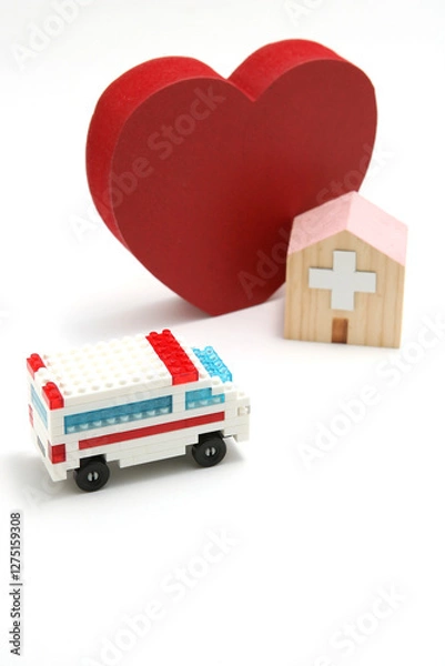 Fototapeta 医療と救急のイメージ 　ハート・病院・救急車のミニチュア