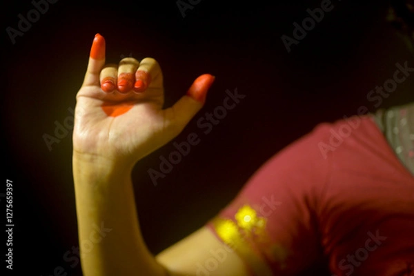 Obraz Close up of a female's hand depicting hand gesture called MrugShirsha (Deer head) in Indian classical dance form; Bharatanatyam, India.