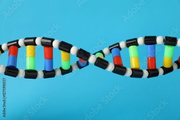 Fototapeta DNA structure model on light blue background, closeup