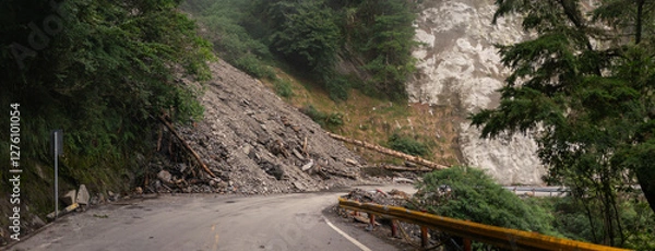 Fototapeta Massive Landslide Blocks Winding Mountain Road, Scattering Debris and Fallen Trees Across Rugged Terrain in Taiwan