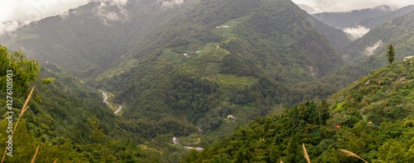 Fototapeta Expansive Green Mountain Valleys with Winding River and Misty Peaks Reflecting Taiwan’s Remote Wilderness and Serenity