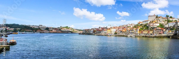 Fototapeta View of the historic city of Porto, Portugal with the Dom Luis bridge and blue sky /  Ancient city Porto,metallic Dom Luis bridge.