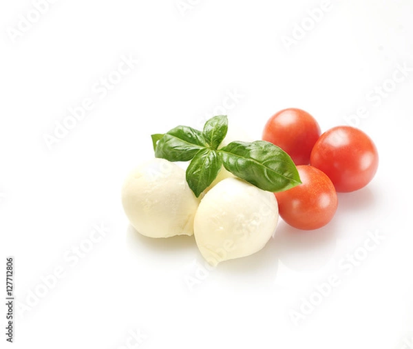 Fototapeta mozzarella, basil and cherry tomatoes on a white background