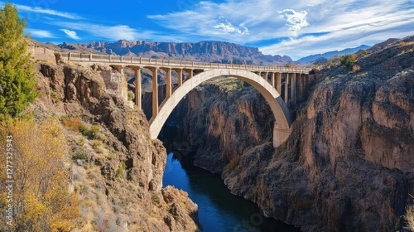 Fototapeta A bridge arching over a deep canyon, symbolizing overcoming challenges and building inner strength.