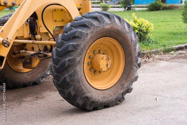 Fototapeta big wheel on yellow tractor