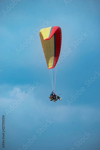 Fototapeta Paragliding over the clouds sunset view at Bir Billing Himachal Pradesh India. Clouds in the sky