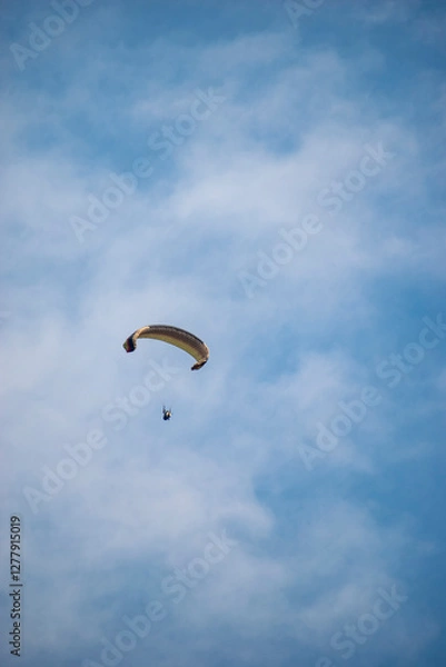 Fototapeta Paragliding over the clouds sunset view at Bir Billing Himachal Pradesh India. Clouds in the sky