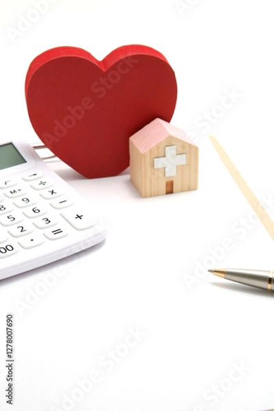 Fototapeta 医療費と健康のイメージ 　 計算機と病院のミニチュア