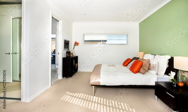 Fototapeta Classic bedroom of a modern house with white Bed and a lot of pi
