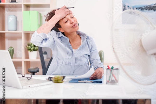 Obraz Woman working and suffering for summer hot weather