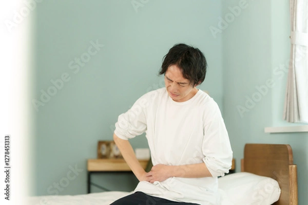 Fototapeta 体調不良のミドル男性