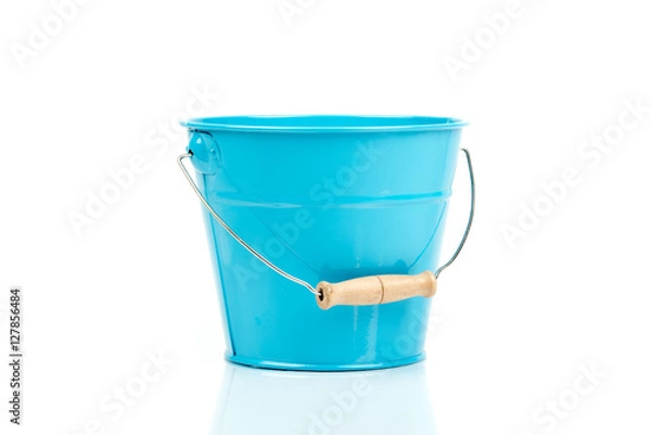 Fototapeta Blue iron/metal bucket/pail/container with handle isolated on white background. Colorful kid child toys. Garden equipment. Side view.