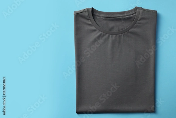 Obraz One blank t-shirt on light blue background, top view. Mockup for design
