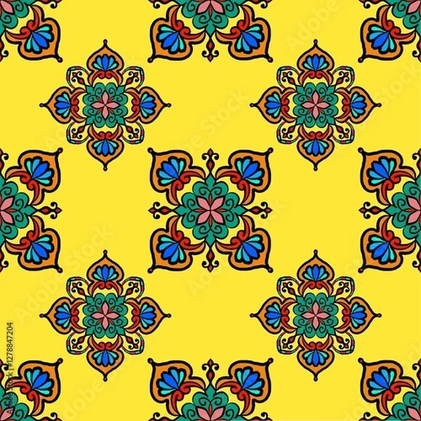 Fototapeta A vibrant yellow patterned design featuring intricate floral motifs in blue, green, and red, creating a lively and decorative appearance.