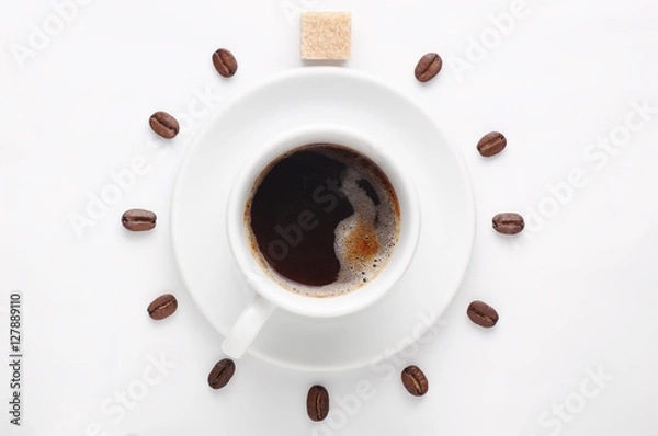Obraz Coffee cup and coffee beans with cane sugar cube against white background forming clock dial viewed from top