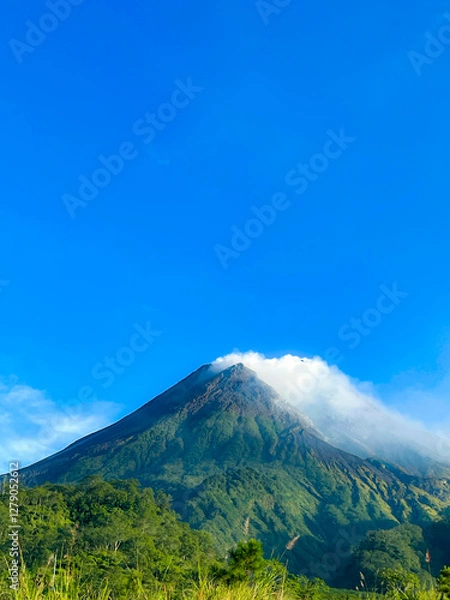 Fototapeta beautiful view of mount merapi against blue sky and white cloud