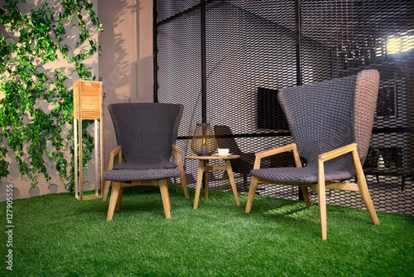 Obraz two comfortable chairs on the grass