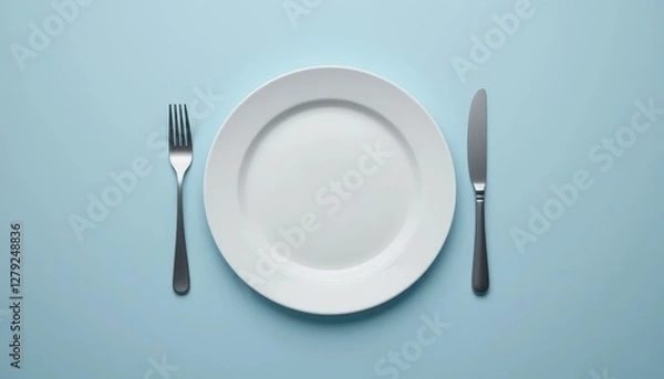 Fototapeta Empty Plate with Fork and Knife on Light Blue Background