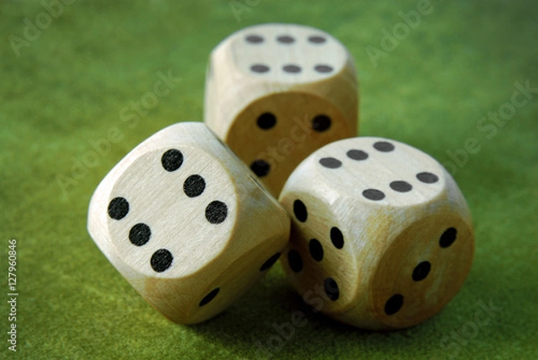 Obraz closeup of the dices on green table